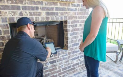 Our technician is explaining chimney repairs needed to customer. Chimney Inspection for Chimney Maintenance - Masters Services