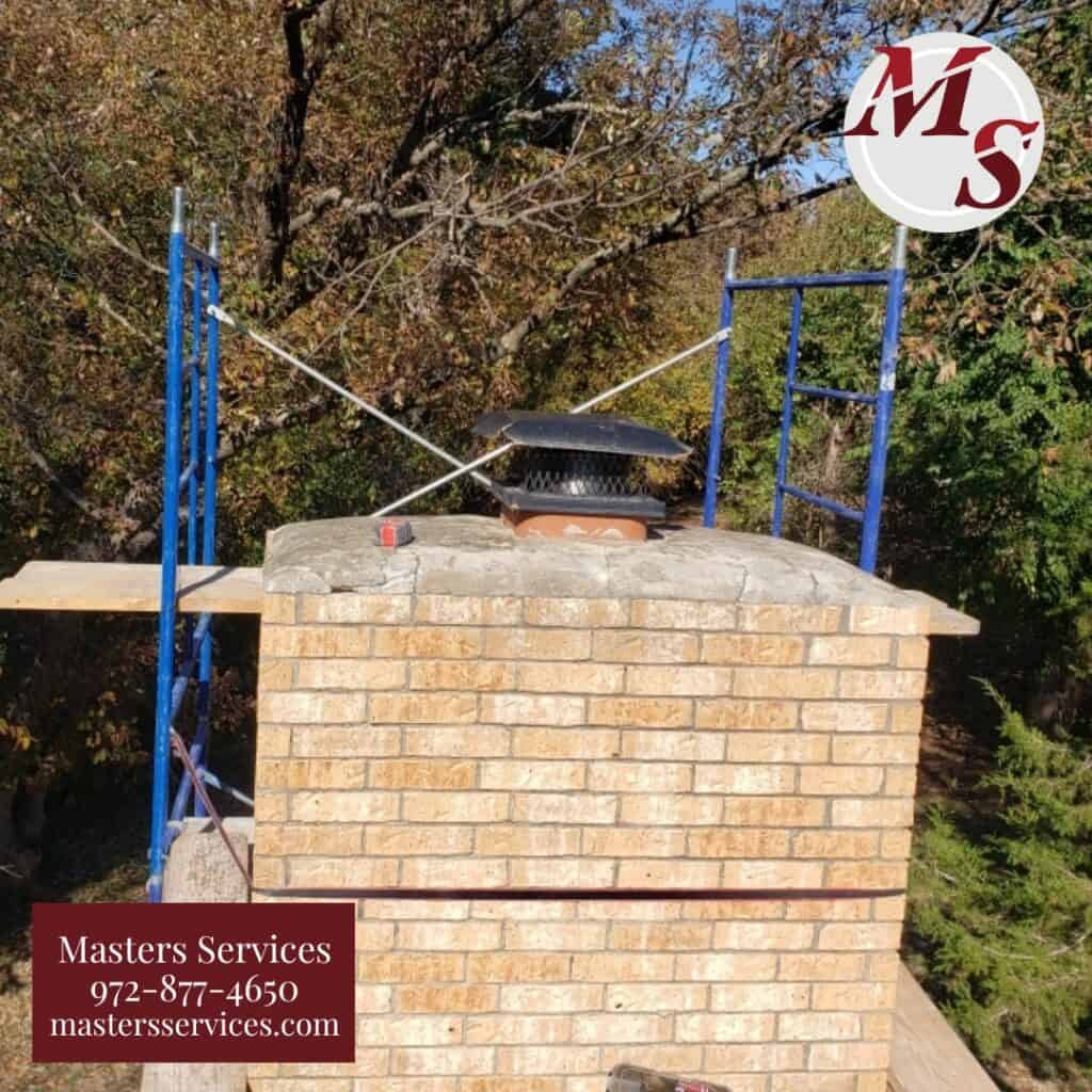 Our team repairing a brick masonry chimney at a home in Dallas, TX