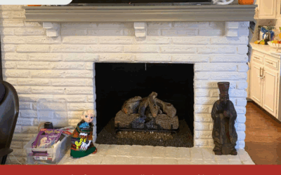 Masters Services Chimney & Masonry team preparing a fireplace for gas log installation.