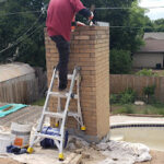 Chimney Repair Near You in Dallas, TX. Completing Masonry Chimney Repair on Exterior of home