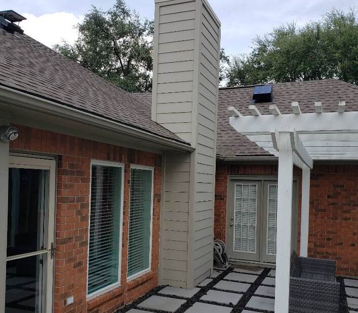 Chimney flashing installation on a Houston, TX home by Masters Services Chimney & Masonry to prevent roof leaks and water damage.